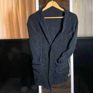 Lightly worn black hip length fleece sweater with front pockets, very comfy.